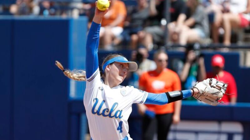 UCLA's Holly Azevedo (4) pitches in the fifth inning of an NCAA softball Women's College World...