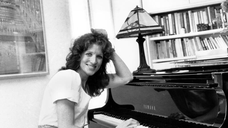 FILE - Lucy Simon sits at the piano in her New York apartment on May 28, 1982. Simon, the...