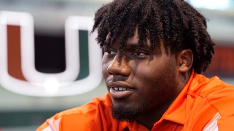 Miami defensive lineman Darrell Jackson speaks with the news media at the team's NCAA college...