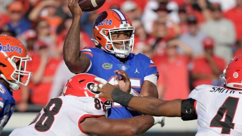 Florida quarterback Anthony Richardson (15) is sacked by Georgia defensive lineman Jalen...