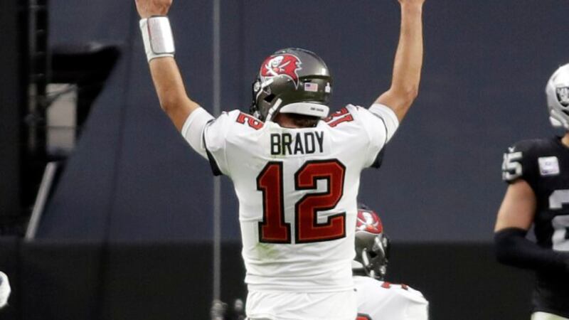 Buccaneer's quarterback Tom Brady reacts after completing a touchdown pass during the second...