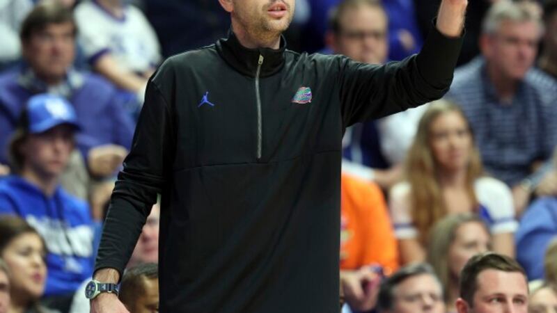 Florida's head coach Todd Golden directs his team during the first half of an NCAA college...