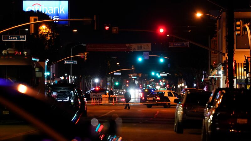 FILE - Police investigate a scene where a shooting took place in Monterey Park, Calif.,...