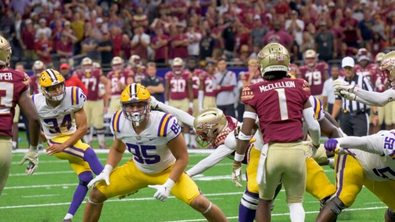 The extra point kick by LSU place kicker Damian Ramos (34) is blocked by Florida State...