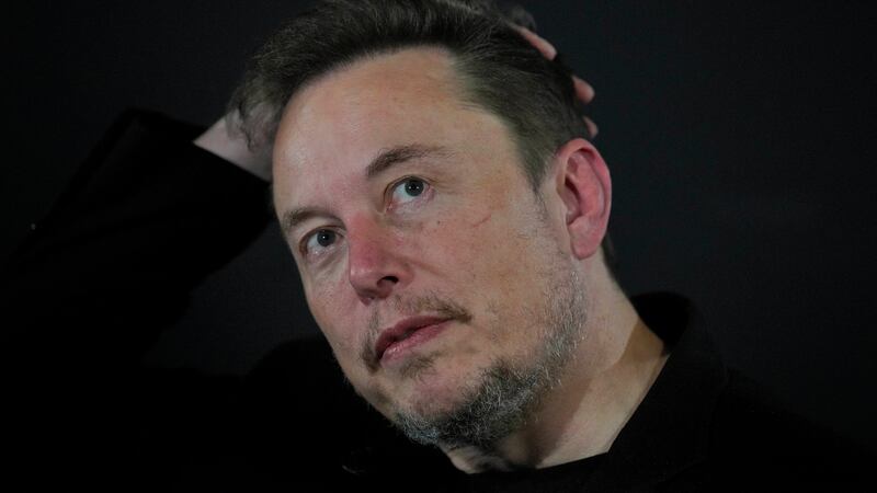 FILE - Elon Musk reacts during an in-conversation event with Britain's Prime Minister Rishi...