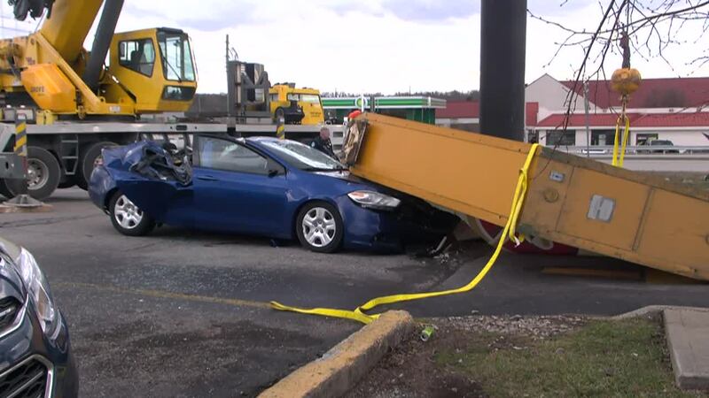 Two people have died and another was injured after a sign fell on a car at a Denny's...