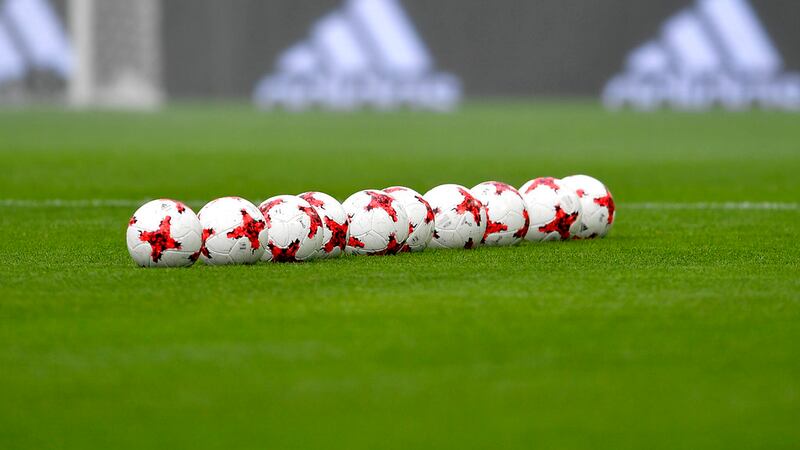Soccer balls are lined up on the pitch prior to the Confederations Cup, Group B match between...