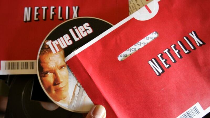File - Mei Michelson prepares to watch a Netflix DVD at her home in Palo Alto, Calif., on Oct....