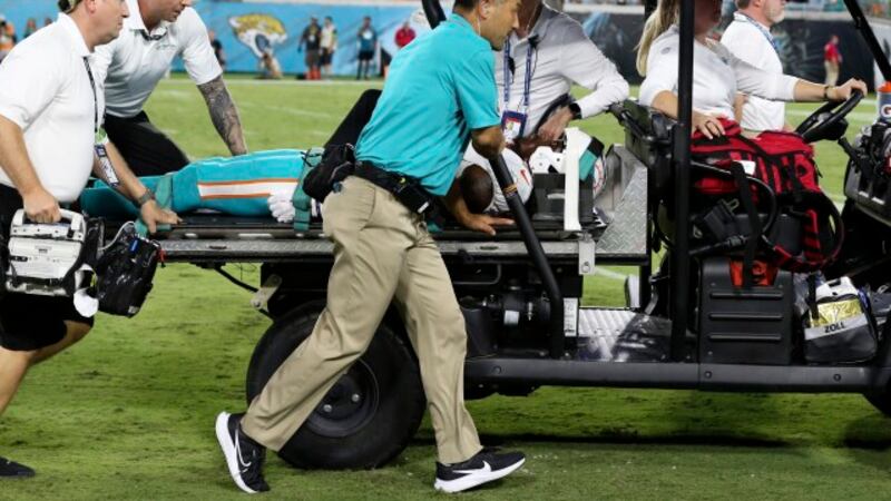 Miami Dolphins wide receiver Daewood Davis is carted off the field during the second half of...