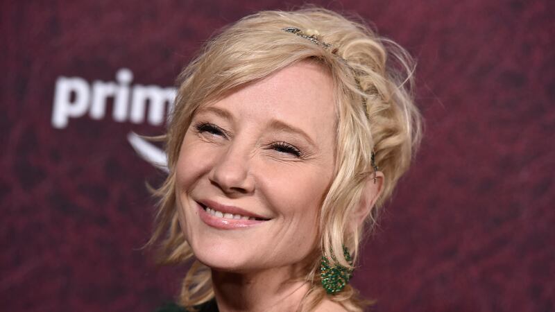 FILE - Anne Heche arrives at the premiere of "The Tender Bar" on Dec. 12, 2021, at the TCL...