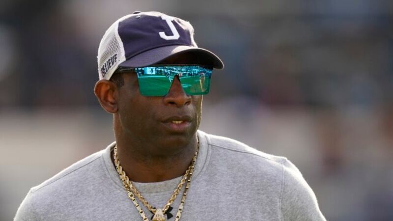 Jackson State head coach Deion Sanders surveys his players during warmups prior to the...