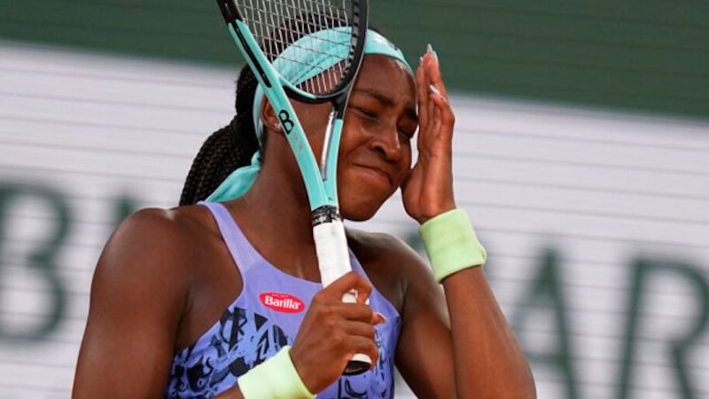 Coco Gauff of the U.S. reacts after missing a shot against Poland's Iga Swiatek during the...
