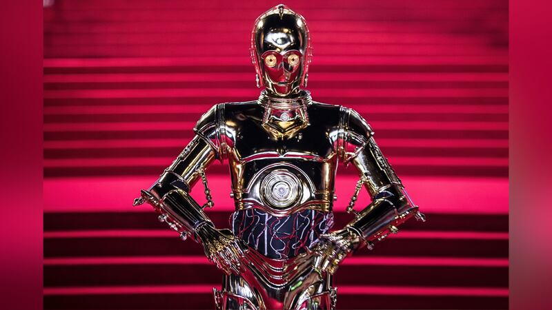 C-3PO poses for photographers ahead of the premiere of the film "Star Wars: The Last Jedi" in...
