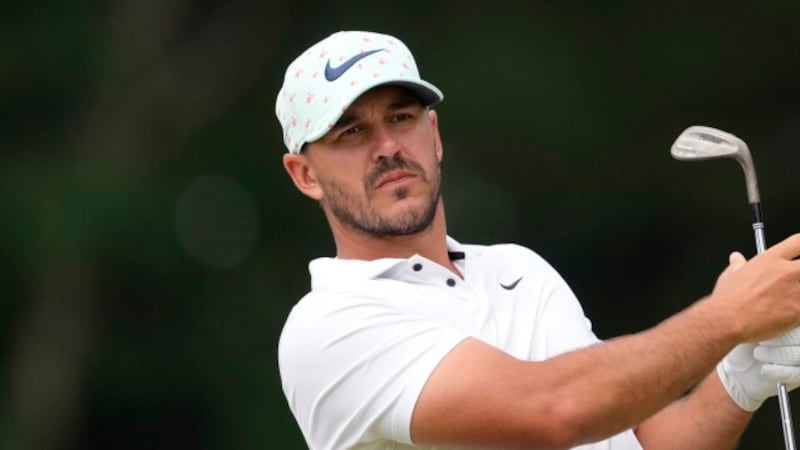 Brooks Koepka watches his shot on the 11th hole during the second round of the U.S. Open golf...