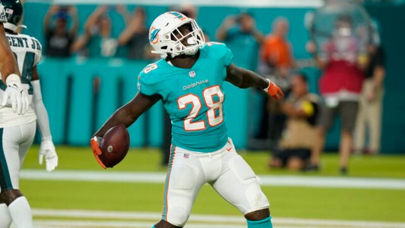 Miami Dolphins running back Sony Michel (28) celebrates a touchdown during the first half of a...