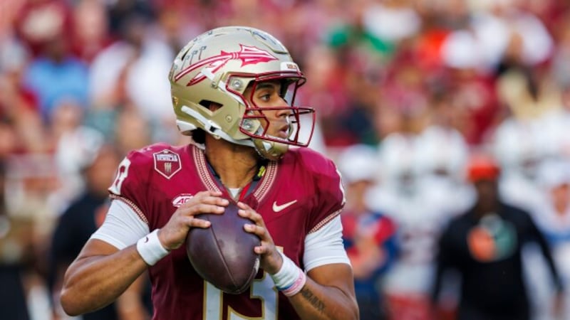 Florida State quarterback Jordan Travis looks for a receiver during the first half of an NCAA...