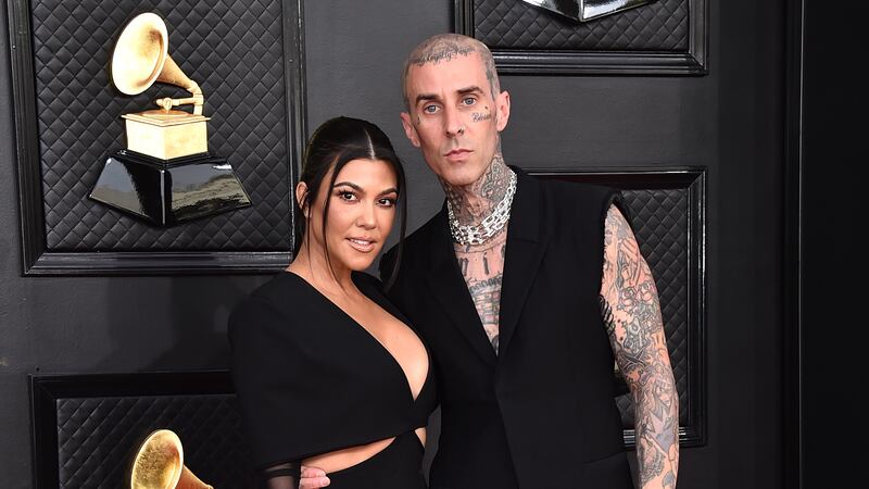 FILE - Kourtney Kardashian, left, and Travis Barker appear at the 64th Annual Grammy Awards in...