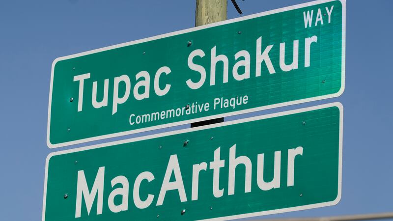 A new sign is seen following a street renaming ceremony for Tupac Shakur in Oakland, Calif.,...