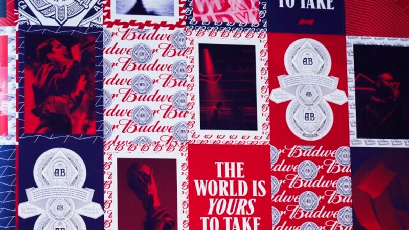 Ads for Budweiser are seen at a hotel hosting a major bar for the beermaker in Doha, Qatar,...