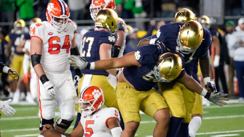 Notre Dame defensive lineman Howard Cross III takes a bow after sacking Clemson quarterback DJ...