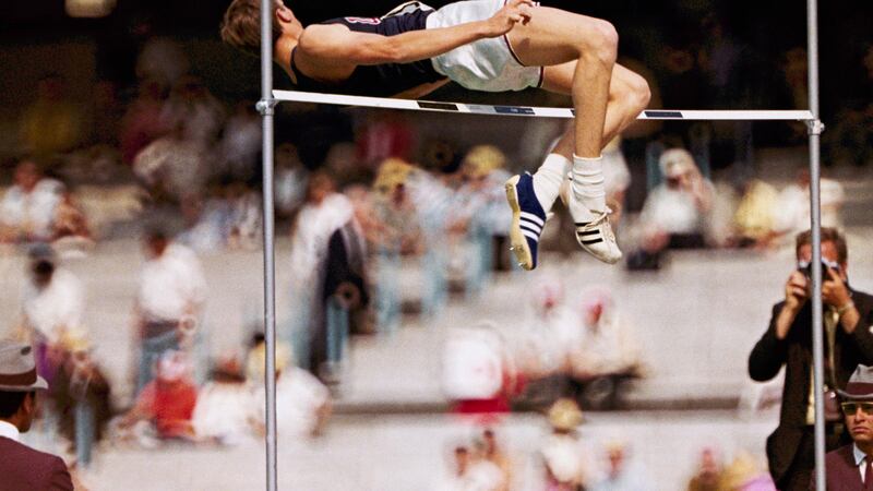 Dick Fosbury, of the United States, clears the bar in the high jump competition at the 1968...