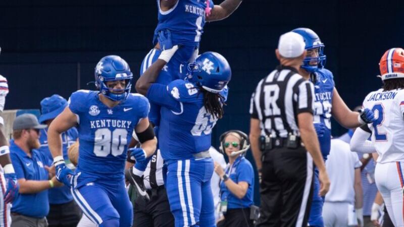 Kentucky running back Ray Davis (1) celebrates his touchdown in the endzone during the first...