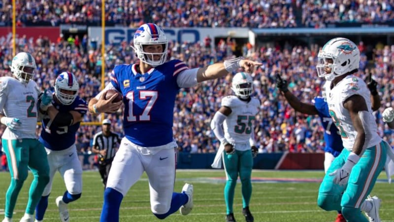 Buffalo Bills quarterback Josh Allen (17) rushes for an 11 yard touchdown during an NFL...
