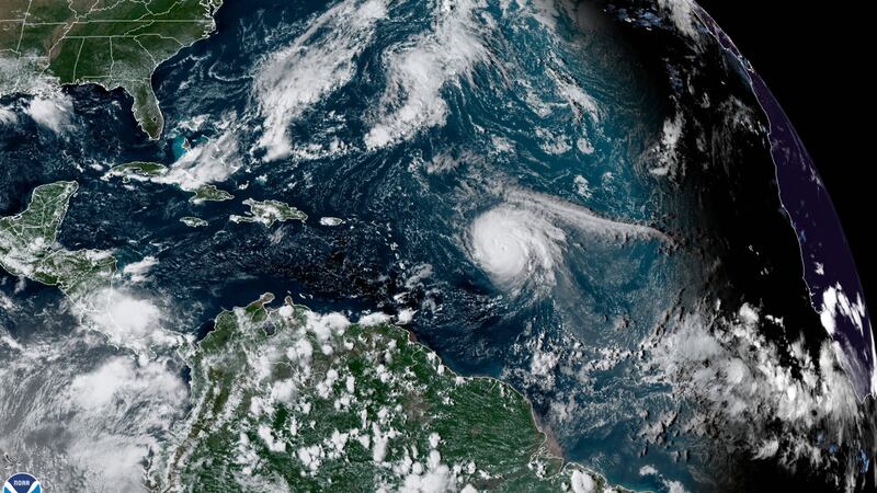 This satellite image provided by the National Oceanic and Atmospheric Administration shows...